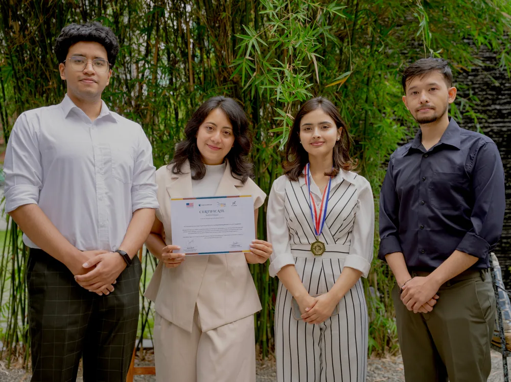 Team Myra holding their certificate after winning first place at YuwaXcel